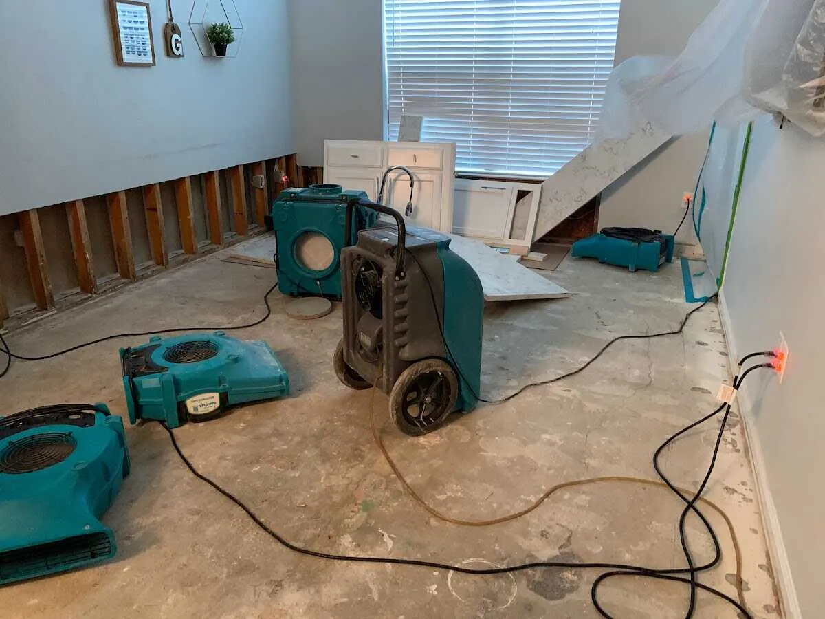 Dehumidifier in flood-cut room for Water Damage Restoration in Algona